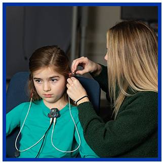 Audiology student working with a pediatric SP